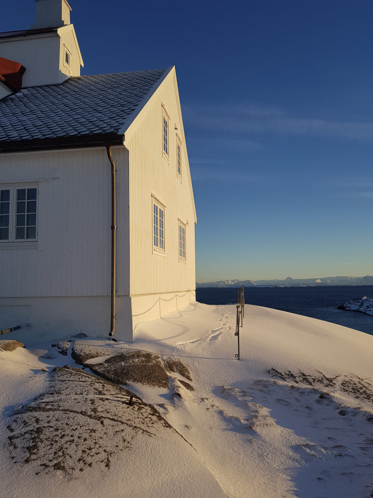 Low sunshine and a light dust of powder at Myken lighthouse © Myken fyr