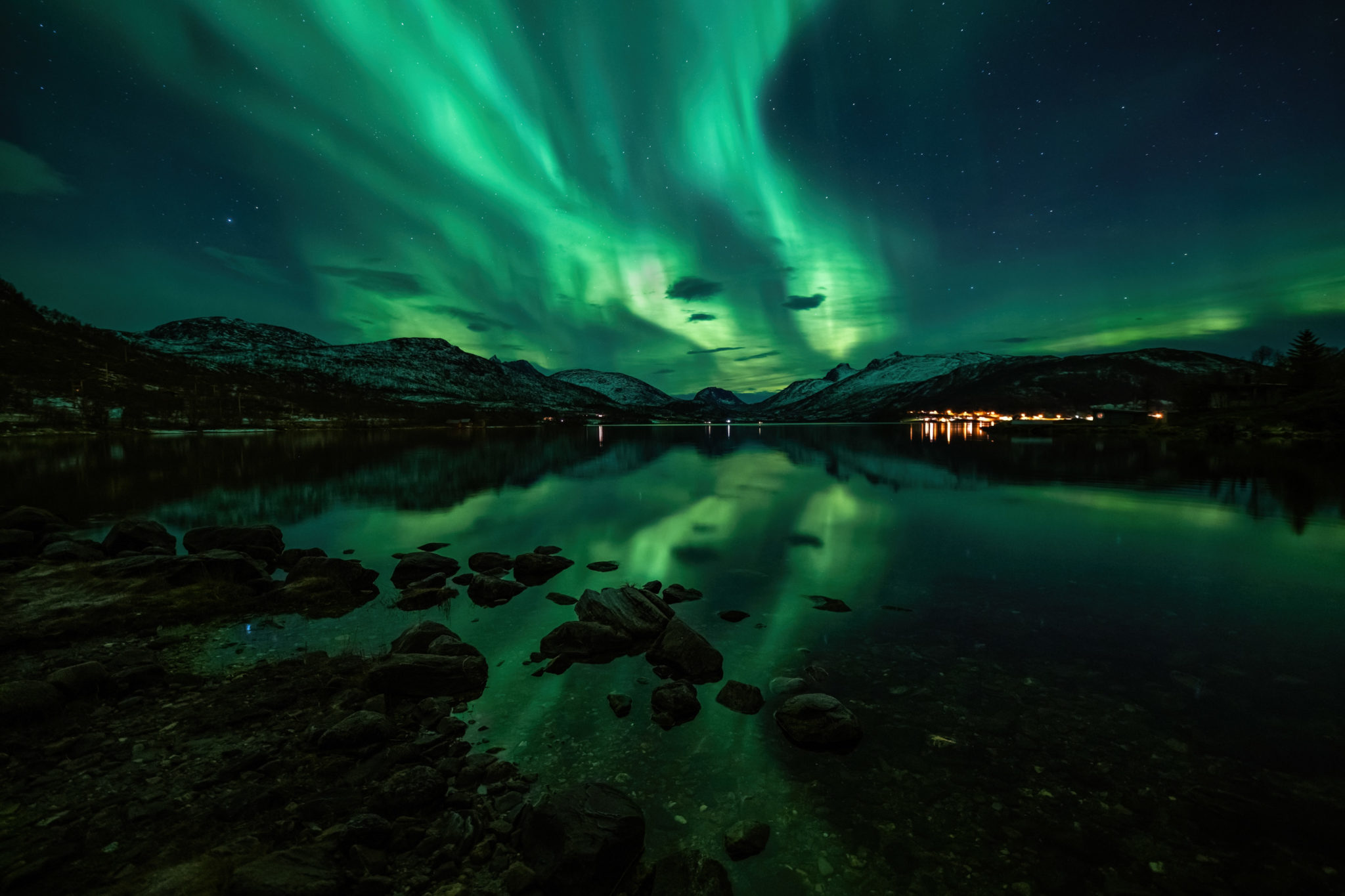 Green evening with lights afar © Kristoffer Vangen