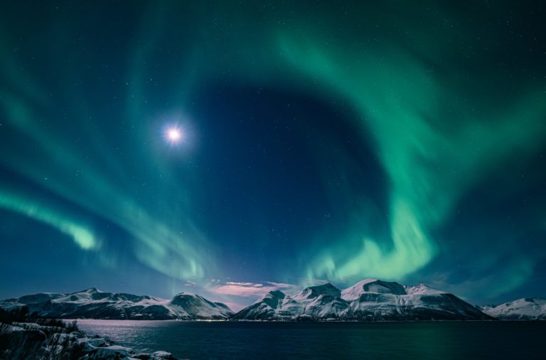 Northern Lights and moonlight over the islands of northern Lyngenfjord © Petr Pavlíček / Visit Lyngenfjord